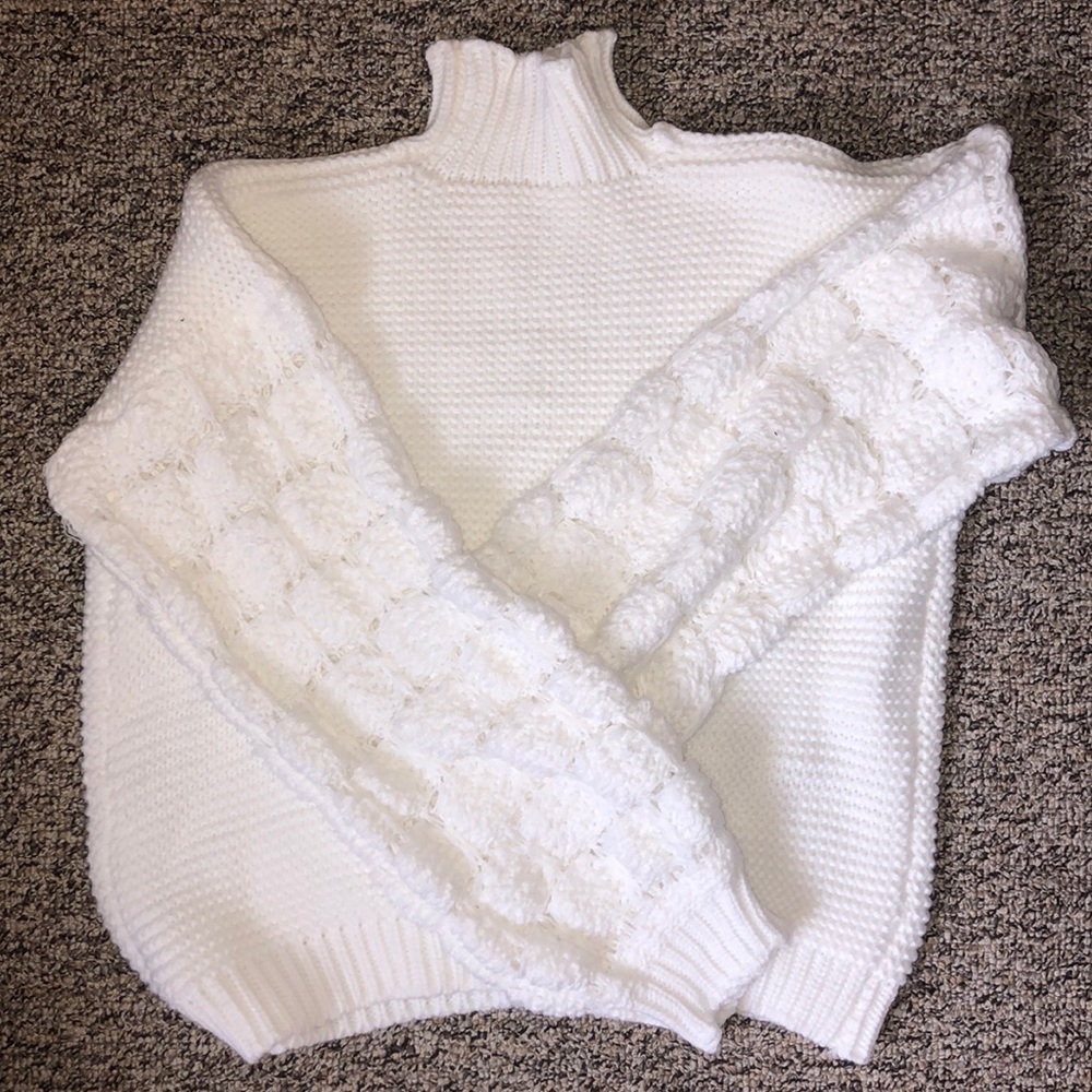 White knitted turtle neck sweater